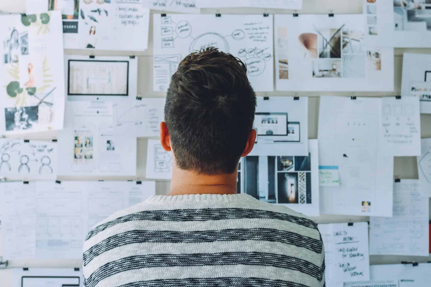 Man looking at plan board