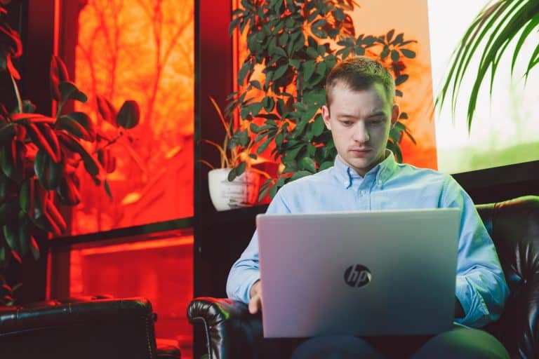 Man working on HP laptop Man working on HP laptop