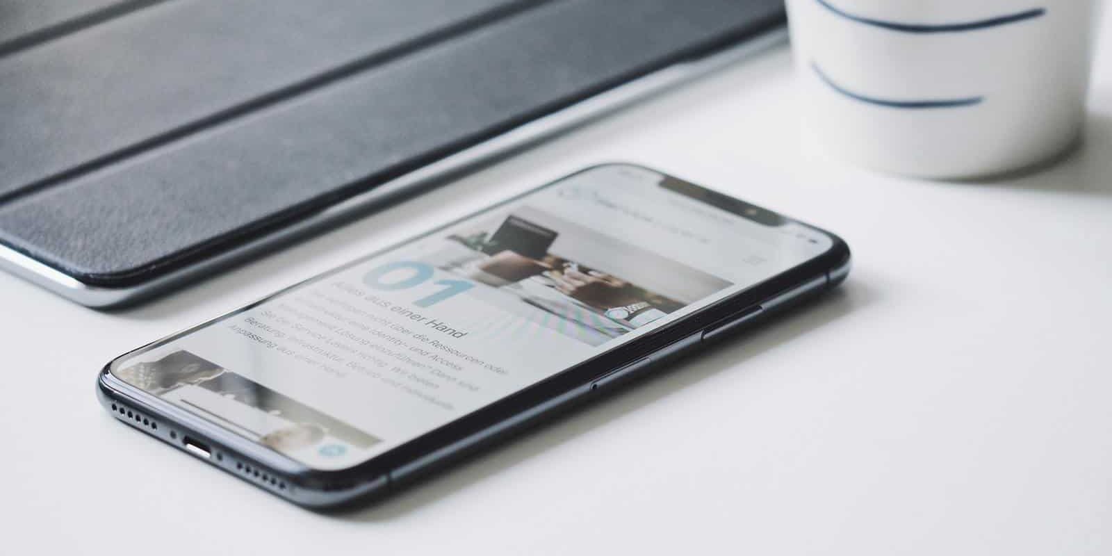 Mobile phone on white desk