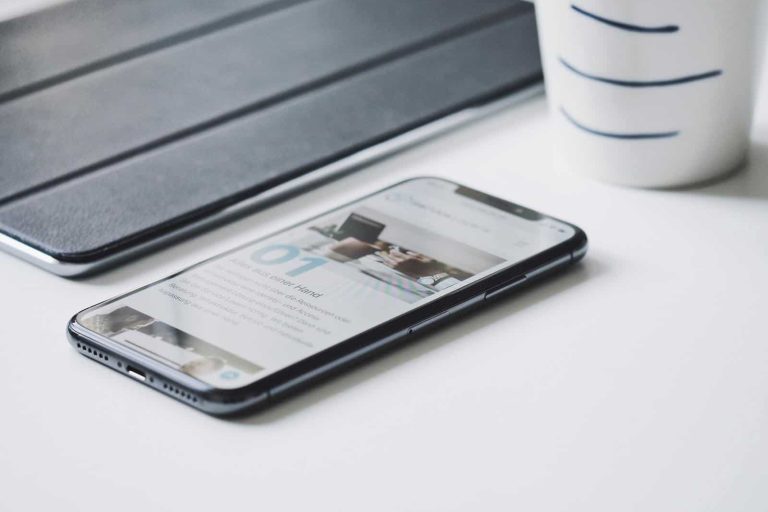 Mobile phone on white desk