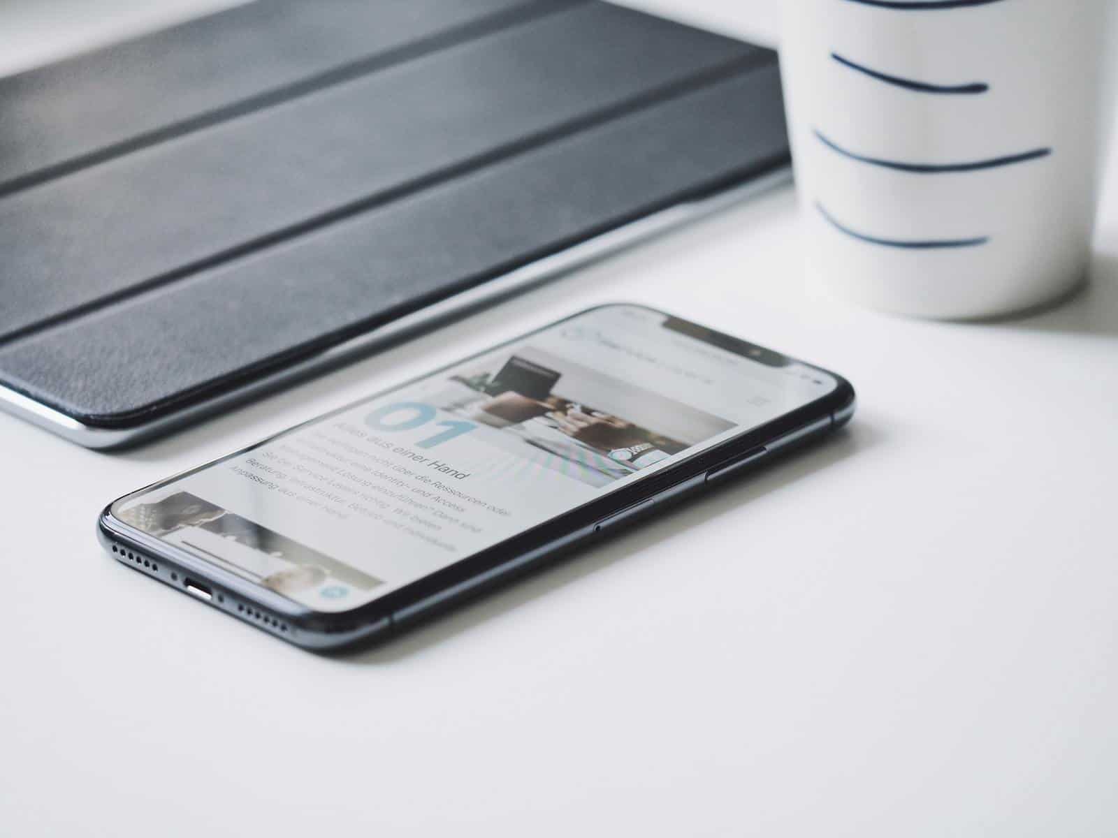 Mobile phone on white desk