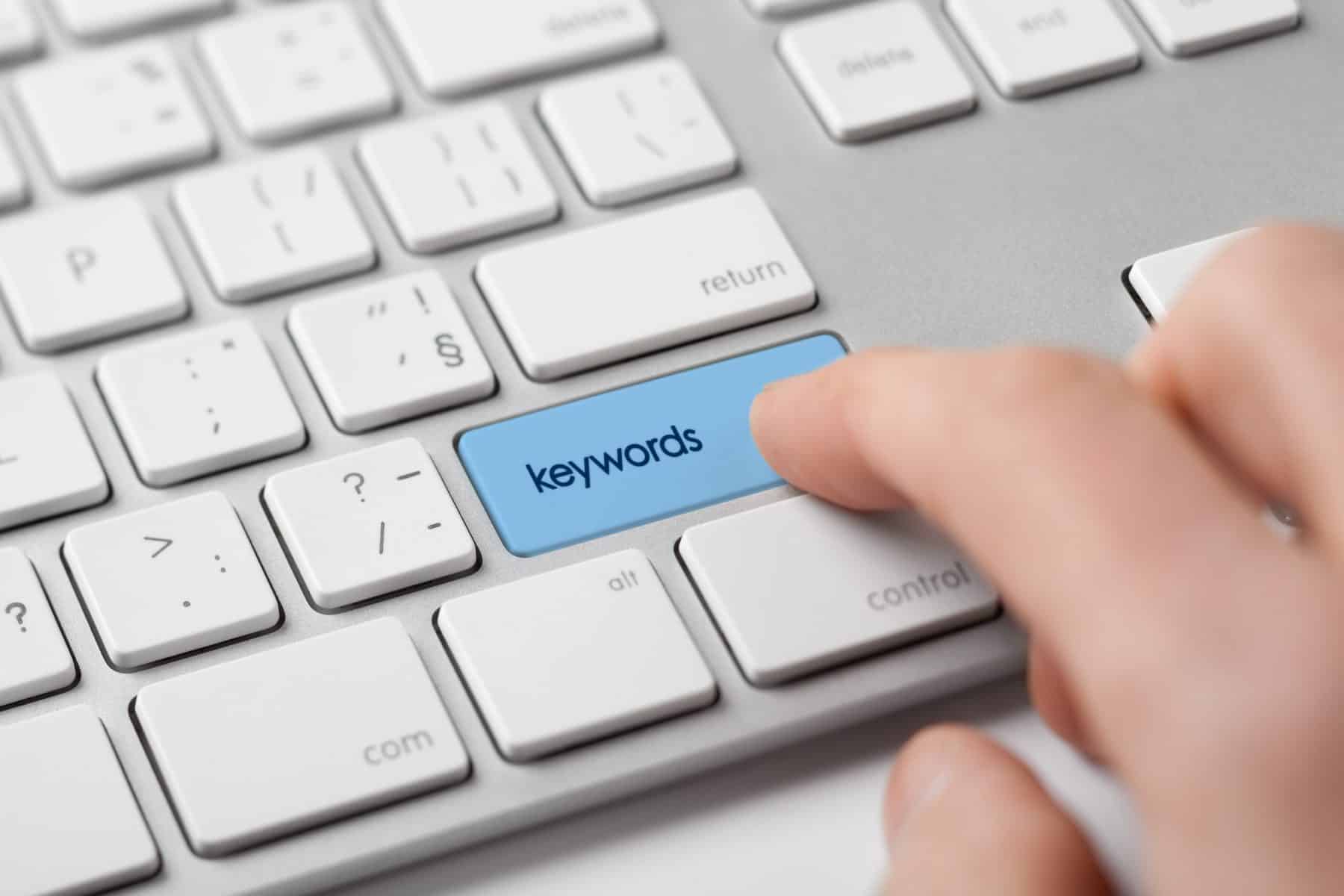 Person pressing keyword button