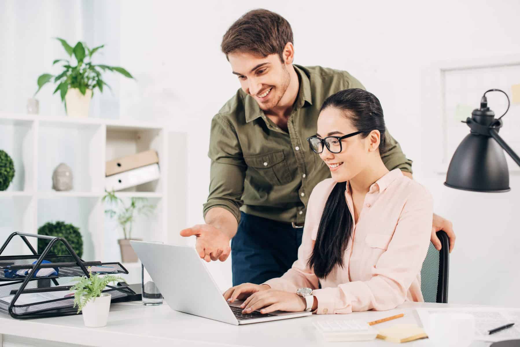 Man and woman looking at laptop