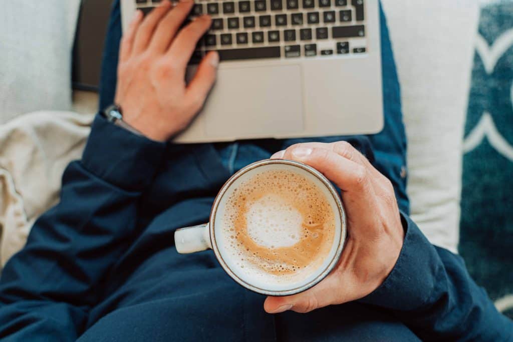 Man with laptop and coffee