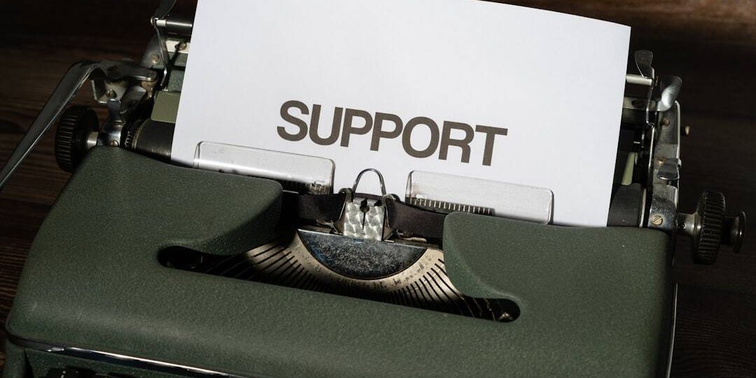 a close up of a typewriter with a paper on it support request email snapchat help