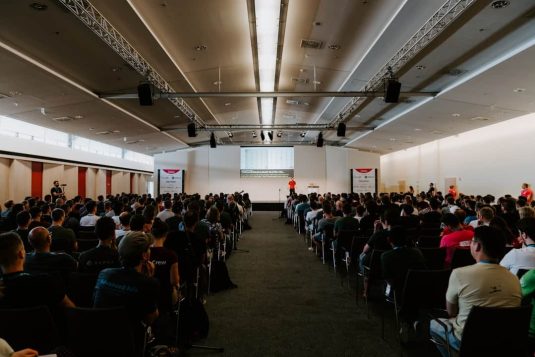 men and women sitting on chairs inside room seo conference, networking, digital event