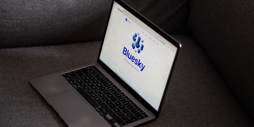 a laptop computer sitting on top of a gray couch shopify dashboard laptop interface