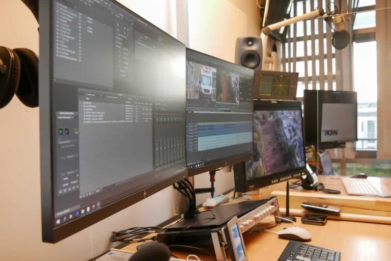 black flat screen computer monitor on brown wooden desk video editing software timeline proxy editing