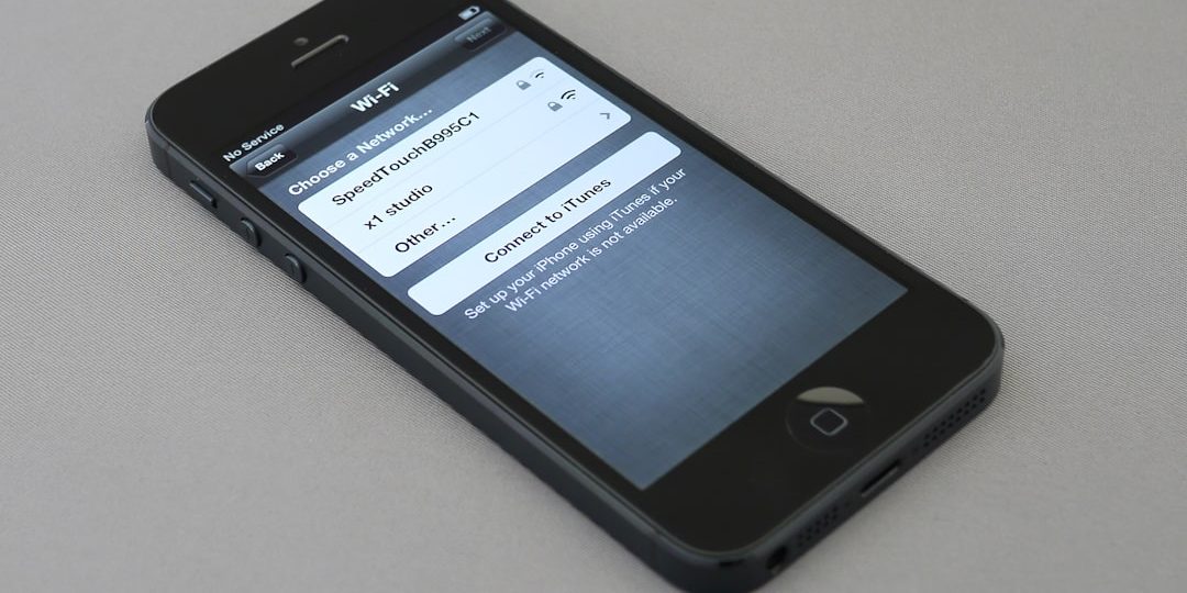 black iPhone 5 settings screen, photos default app, file types