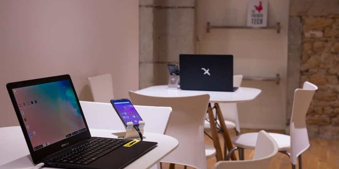 black laptop computer on white wooden table vpn setup, students, mobile devices, laptops