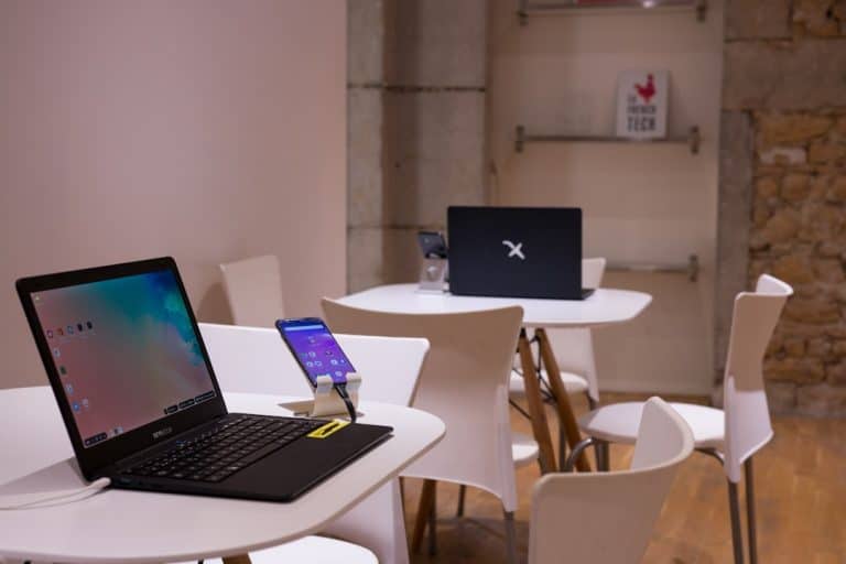 black laptop computer on white wooden table vpn setup, students, mobile devices, laptops