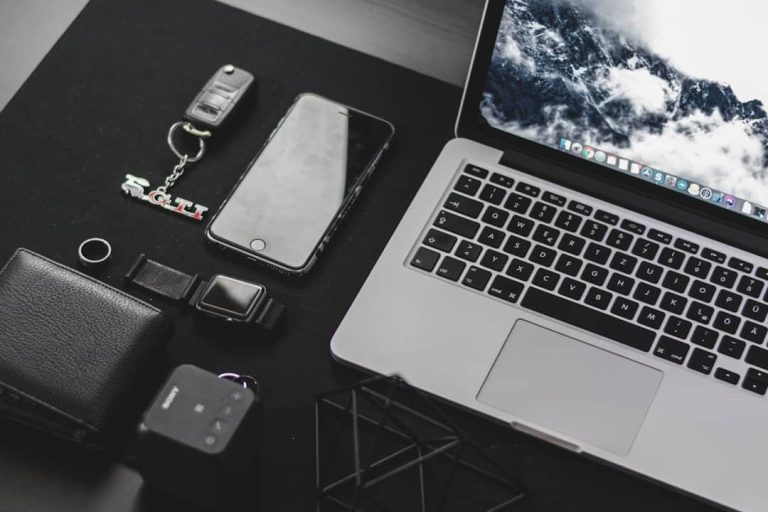 MacBook Pro on top of desk disk utility, mac permissions, first aid