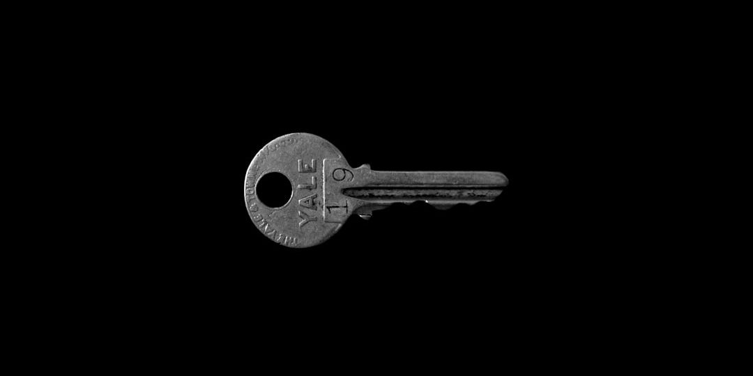 closeup photo of Yale 19 key against black background invalid key error, site owner, cryptography