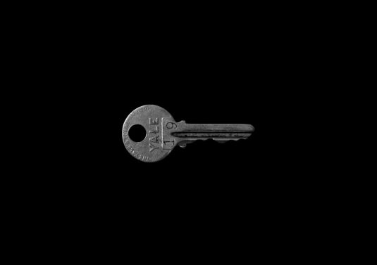 closeup photo of Yale 19 key against black background invalid key error, site owner, cryptography
