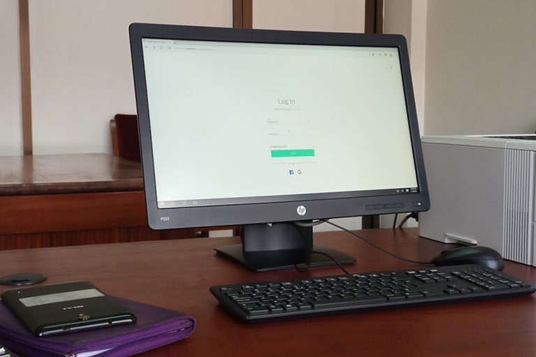 black computer monitor turned on beside black computer keyboard local account setup, no internet, microsoft login bypass