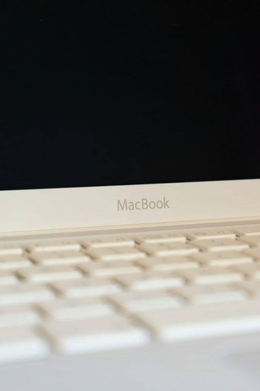 white macbook air turned off macbook error message, frustrated user, file problem