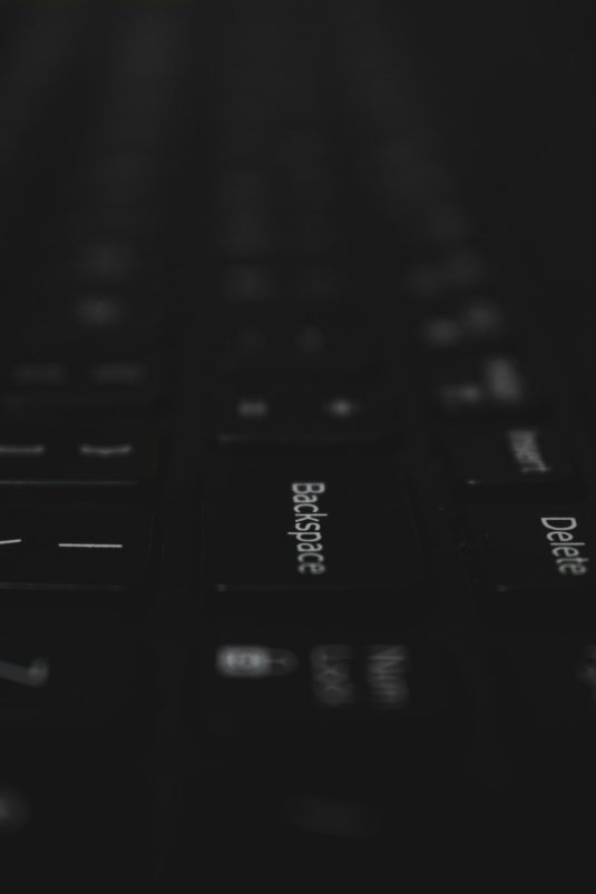 a close up of a black keyboard with white letters wrong subtitles, language menu, streaming settings