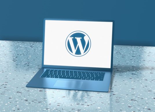 a laptop computer sitting on top of a table broken website, wordpress theme error, missing logo