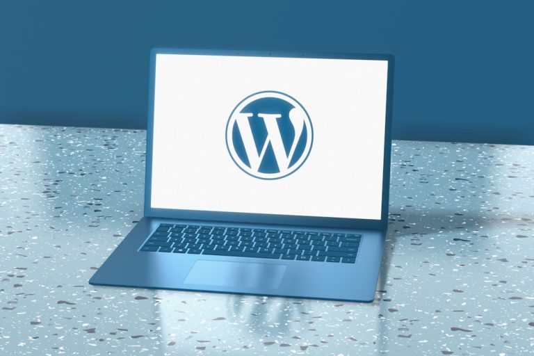 a laptop computer sitting on top of a table broken website, wordpress theme error, missing logo