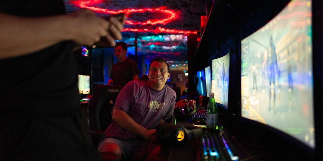 People playing video games in a dimly lit room. gaming pve boss fight fantasy