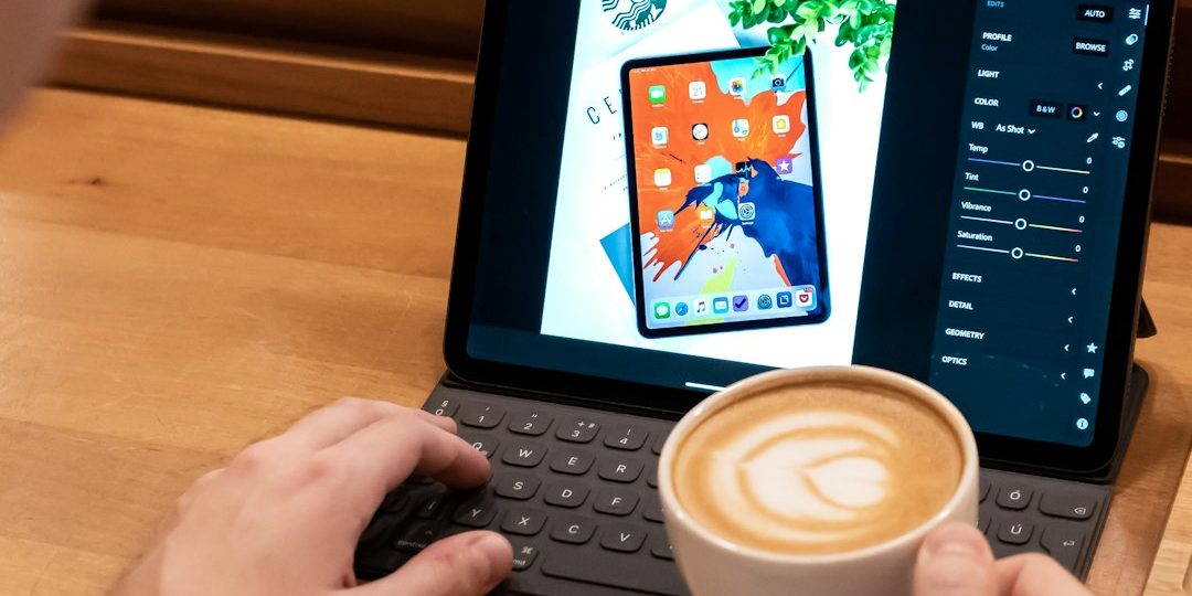 person using laptop ipad writing keyboard cafe coffee