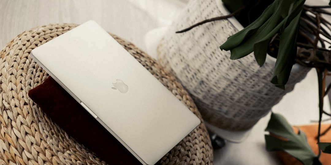 silver macbook on brown woven basket wifi troubleshooting smartphone router