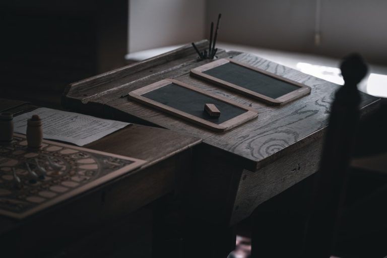 a wooden desk with a tablet and pen on it sql table creation, users table, database schema
