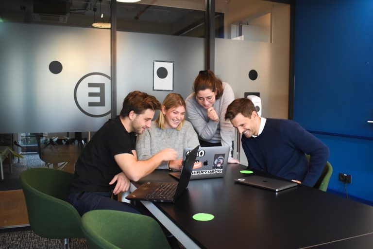 people sitting on chair in front of laptop computers flock app, chat with tasks, startup team meeting