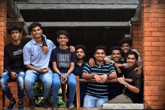 smiling group of men engineering lab, research team, artificial intelligence project, students working
