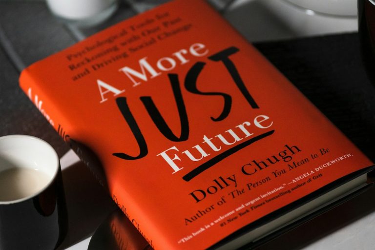 an orange book on a table entrepreneur habits, daily routine, goal setting, morning routine