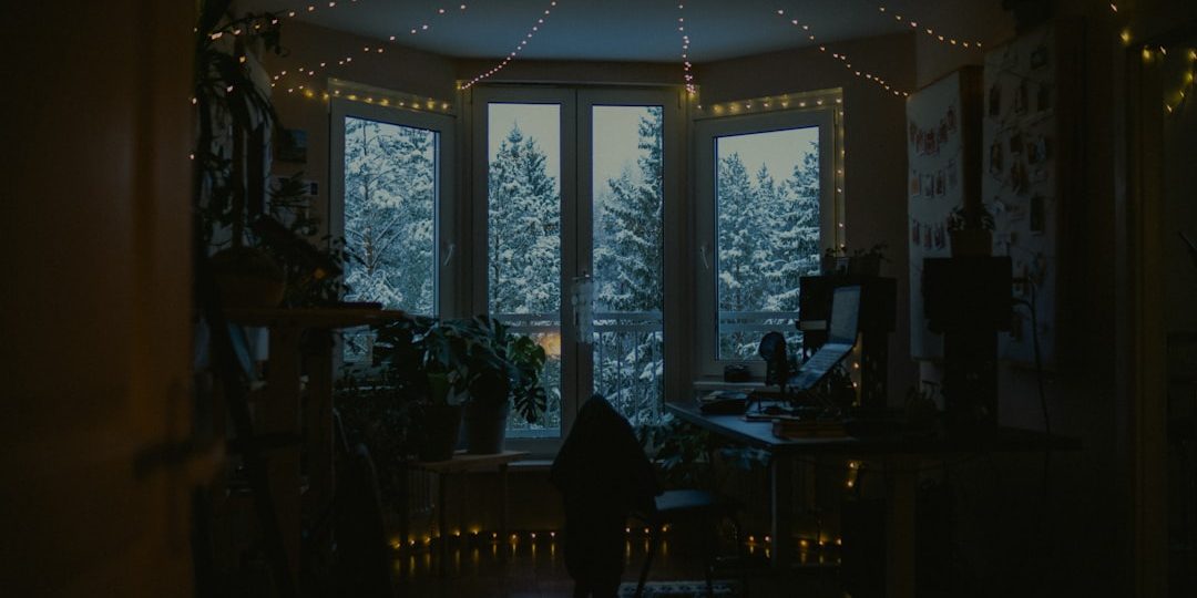 Cozy room with fairy lights and snowy window view. fantasy set design, mystical lights, escape room effects